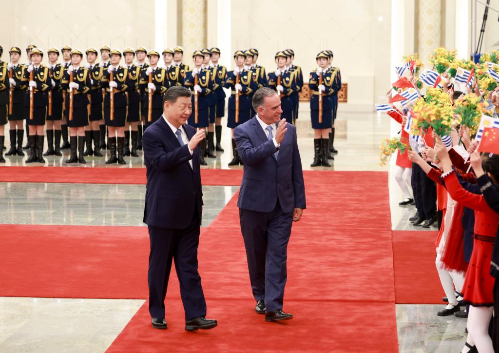 China, Uruguay move to upgrade ties as leaders meet in Beijing