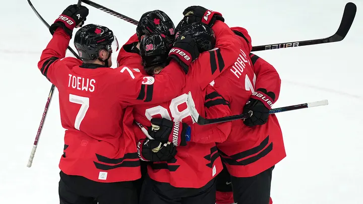 Team Canada players celebrate a goal by Cale Makar during the second period of the men's ice hockey gold medal game against the United States at the 2026 Winter Olympics in Milan, Italy, Sunday, Feb. 22, 2026.  (AP Photo/Carolyn Kaster)